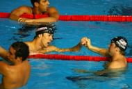 Ian Crocker of the United States of America congratulates Michael Phelps of the United States of America on winning the Men's 100m Butterfly Final during the XII FINA World Championships at the Rod Laver Arena on March 31, 2007, in Melbourne, Australia. (Photo by Al Bello/Getty Images)